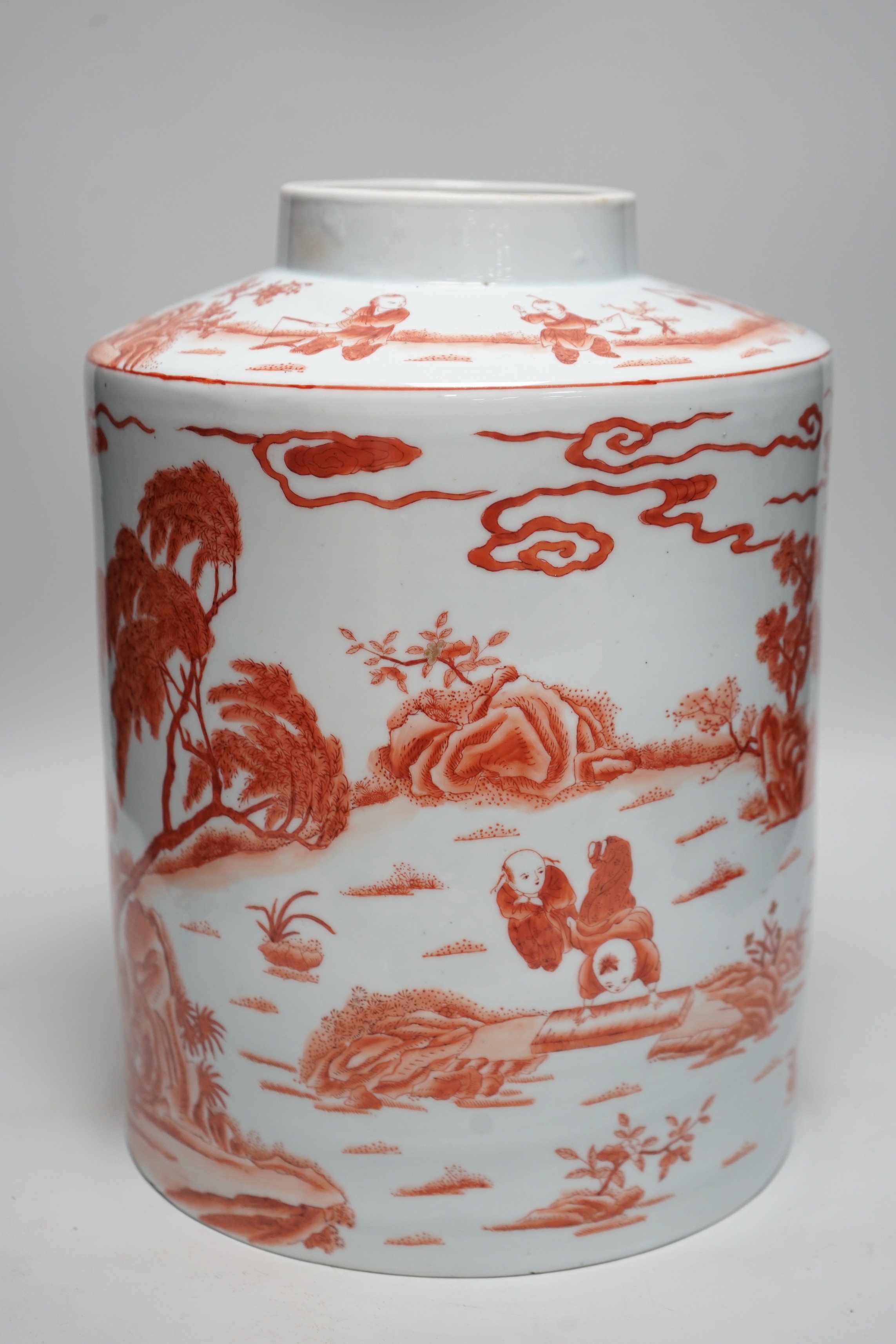 An early 20th century copper red enamelled canister. 30cm tall